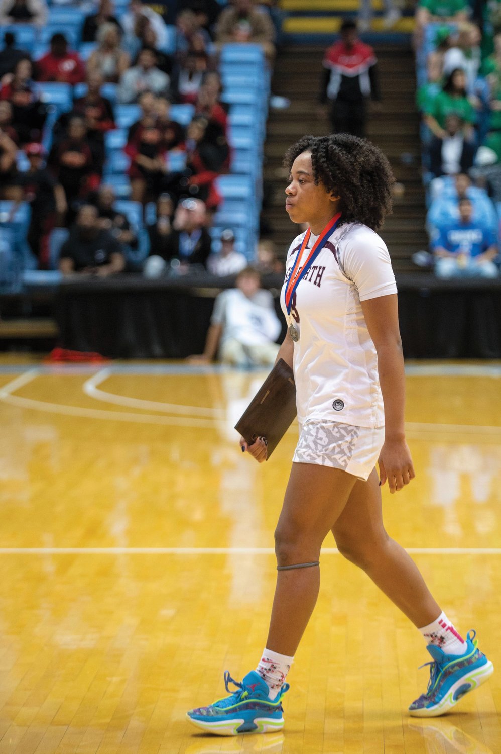 Seaforth sophomore Gabby White walks off the floor after the Hawks' 48-39 loss to Salisbury on Saturday in the 2A state finals.